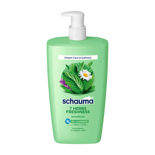 A bottle of Schauma 7 Herbs Freshness Shampoo in a light green plastic pump bottle with a white pump dispenser, featuring a graphic of green leaves and a white daisy on the front label.