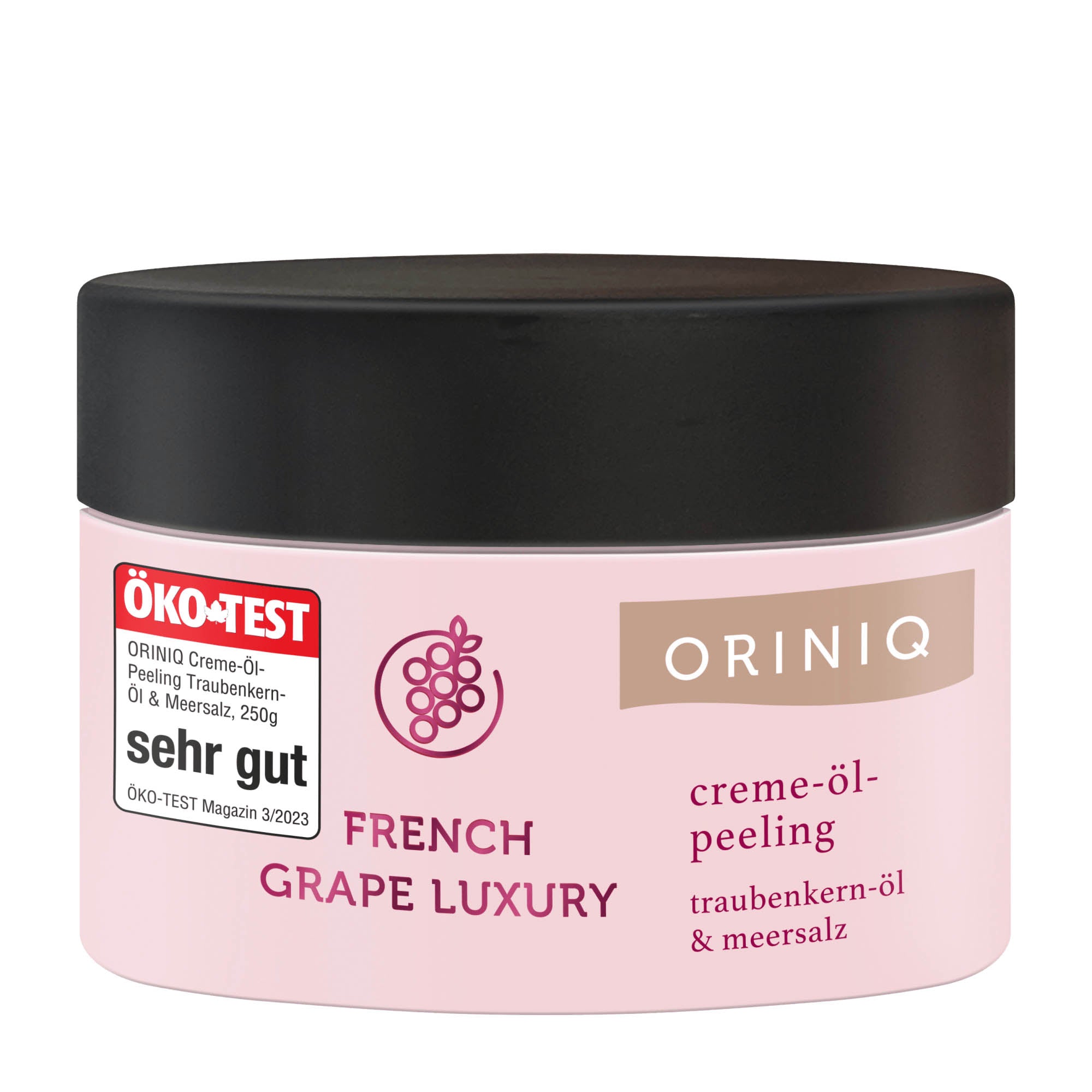 A container of ORINIQ French Grape Luxury cream-oil scrub with the ÖKO-TEST logo indicating a high rating, and the product name and description.