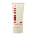 Tube of K-Secret Seoul 1988 Pine Tree + Ceramide SPF50+ Sunscreen on a white background.
