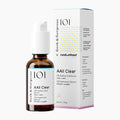 A 101 Geek & Gorgeous x rundumhaut AAll Clear skincare set, featuring an amber glass bottle with a white cap and a white product box with yellow and blue polka dots, on a light gray background.