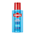 A bottle of Alpecin Hybrid Sensitive Caffeine shampoo with a predominantly blue label and red cap.