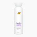 A 350ml white bottle of Dove Body + Mind Serum Shower Gel with lavender and oat milk, set against a plain light gray background.