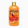 A 500ml bottle of Treaclemoon Sugared Pumpkin Spice shower and bath gel, featuring a bright orange body with a gold cap and a label decorated with pumpkins and autumn illustrations.