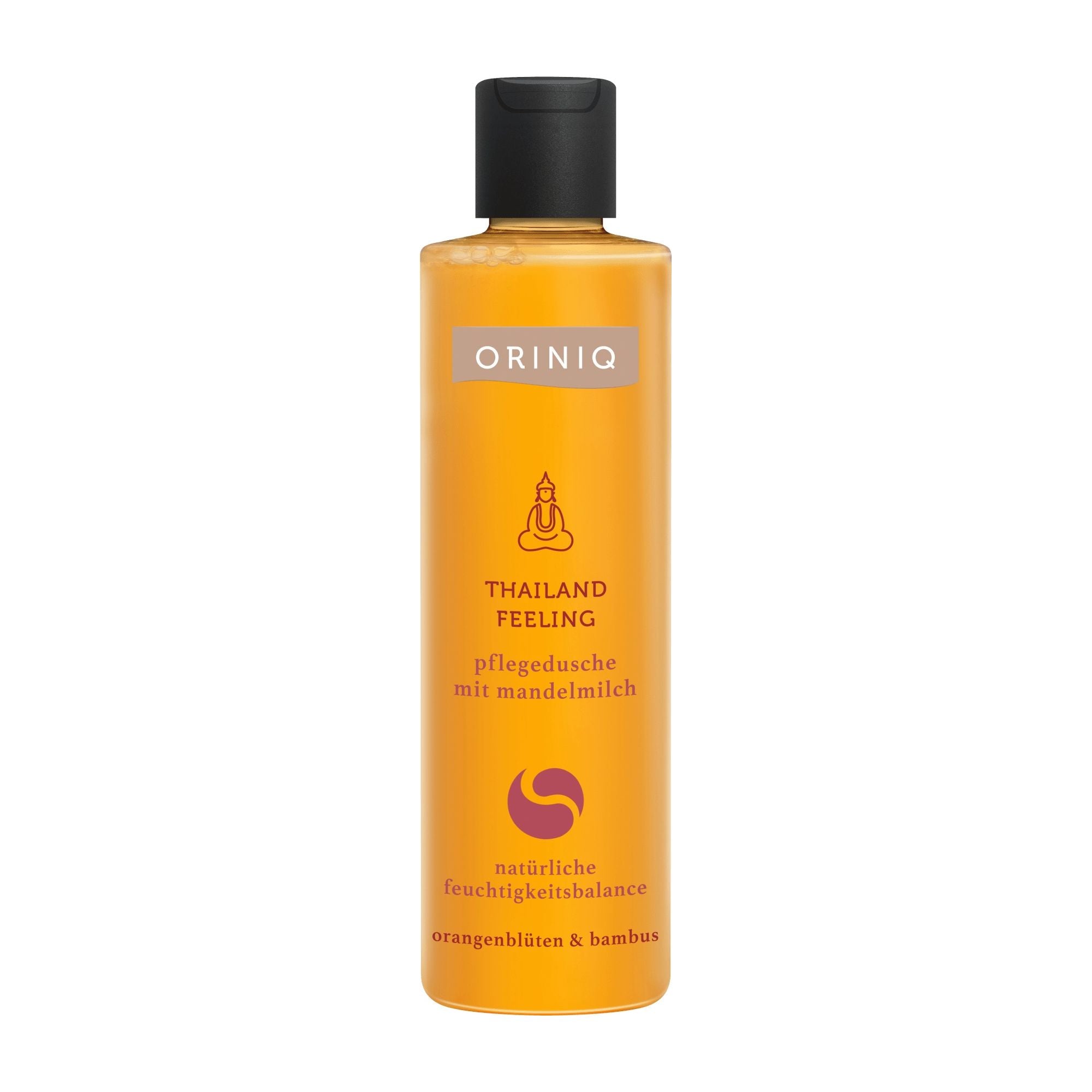 A bottle of ORINIQ Thailand Feeling shower cream with a clear label, orange in color, and text indicating almond milk, orange blossom, and bamboo extracts.