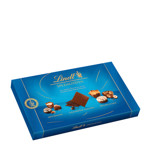 Lindt Specialties pralines box with various chocolate pieces on a white background