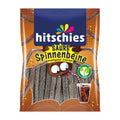Packaging of hitschies Sour Spider Legs cola, showing the product name and an image of the gummy candy, with a glass of cola in the background.