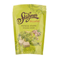 Green packaging of Stühmer pistachio dessert on a white background