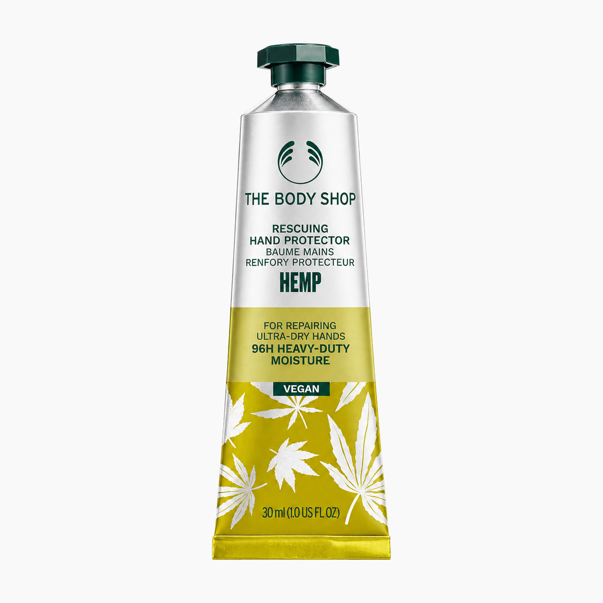 A squeeze tube of The Body Shop Hemp Rescuing Hand Protector hand balm, featuring a silver upper section, a yellow lower section with white hemp leaf illustrations, and a dark green cap, set against a plain white background.