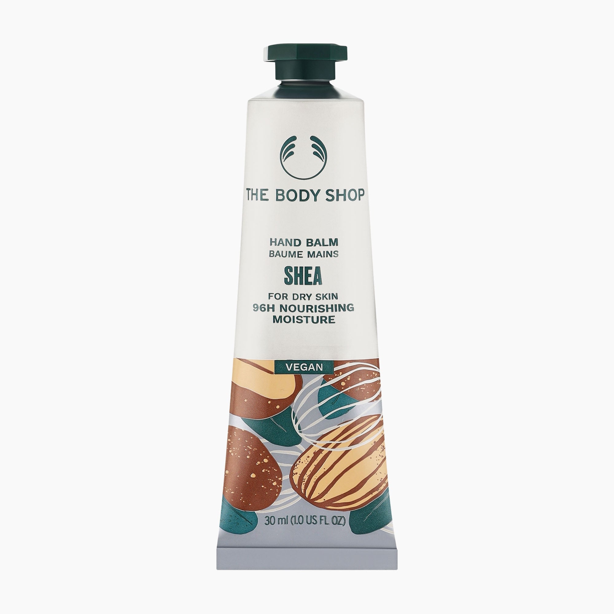 A 30ml squeeze tube of The Body Shop Shea Hand Balm on a clean white background. The tube is white with a dark green cap and features illustrations of almonds and shea nuts near the bottom.