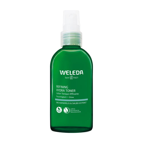 Green Weleda pump bottle of refining hydra toner on a white background