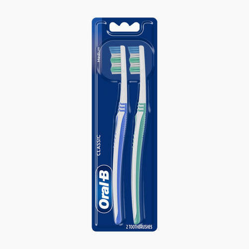 Oral-B Classic 2-pack toothbrushes in blue packaging on a light gray background.