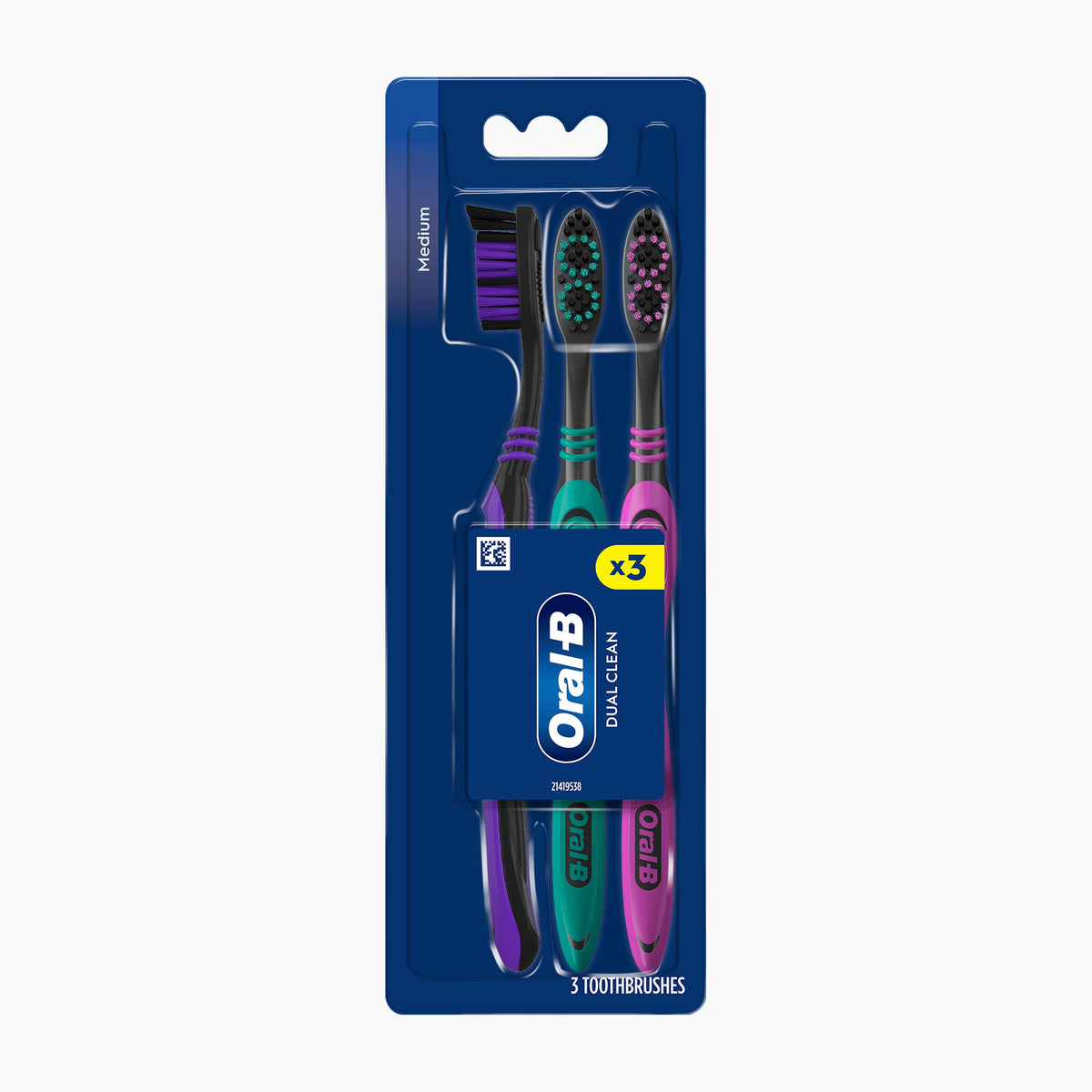 A 3-pack of Oral-B Dual Clean toothbrushes, sealed in their original blue retail blister packaging against a light gray background.