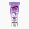 L'Oréal Paris Elvital Hydra Hyaluronic Overnight Hair Treatment in a lavender purple squeeze tube with a white cap, shown on a light gray background.