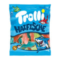 A package of Trolli Sharks candy shaped like sharks, displayed against a blue background.