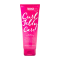 Pink tube of Umberto Giannini Curl Jelly Care conditioner on a white background