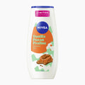 Nivea Vanilla Pecan Praline Shower Gel in a white bottle with a blue cap, featuring an orange and green label with a chocolate pecan graphic.