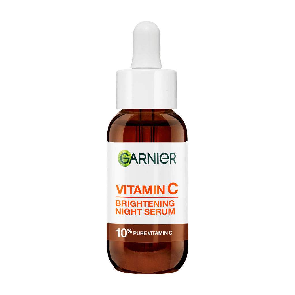 Glass of Garnier Vitamin C Brightening Night Serum on a white background