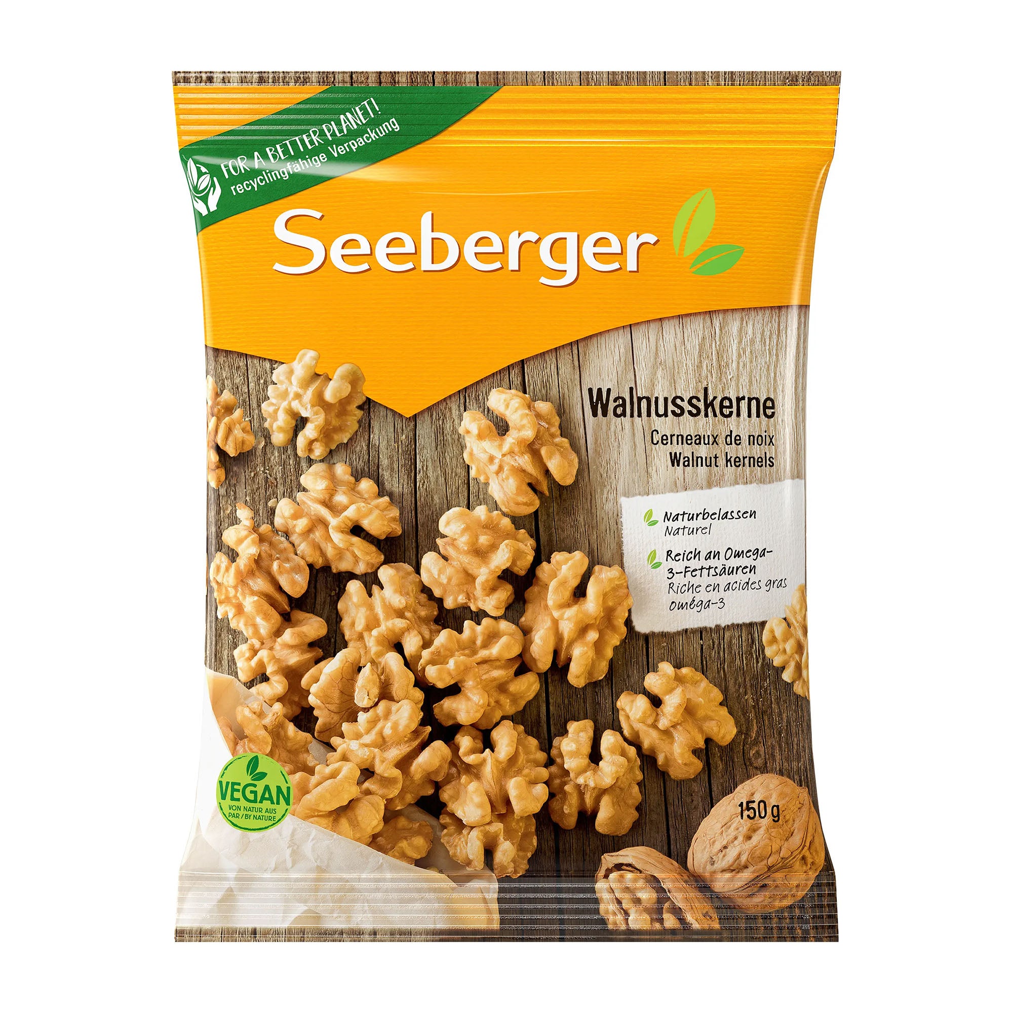 Package of Seeberger walnut kernels with a wooden background