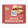 Ritter Sport Weisse Spekulatius White Speculoos white chocolate bar packaging in pink, featuring illustrations of white chocolate and biscuit cookies, with Ritter Sport branding and German text.