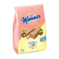 A package of Manner Wholegrain Wafer Bars with the brand name and 'Waferbar' visible on the front. The background is pink, and there is an image of the wafers with hazelnuts on the package.