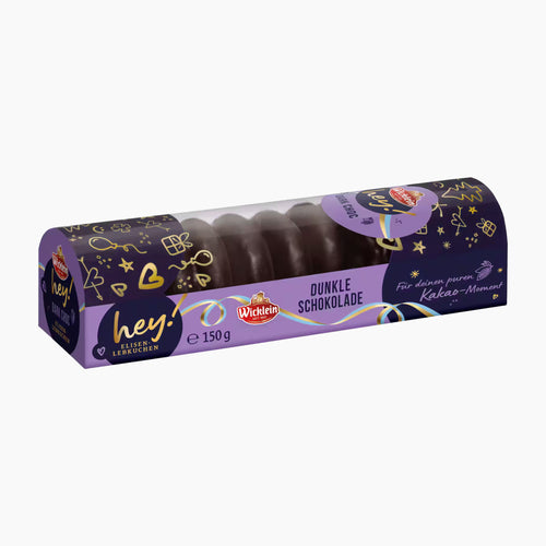 A 150g package of Wicklein hey! Mini Elisen Gingerbread Dark Chocolate in a cylindrical box with a clear window showing the dark chocolate covered gingerbread cookies inside. The packaging features a purple and black design with gold doodles and text.