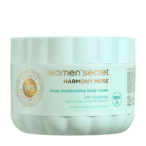 A jar of Women'Secret Harmony Muse Deep Moisturizing Body Cream on a plain white background. The jar is a pale mint green with a matching lid, featuring a white label with gold and teal text.