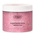 A jar of Ziaja Marshmallow sugar body scrub with natural caramelized sugar crystals visible, and labeled as delicious care strawberry fluff.